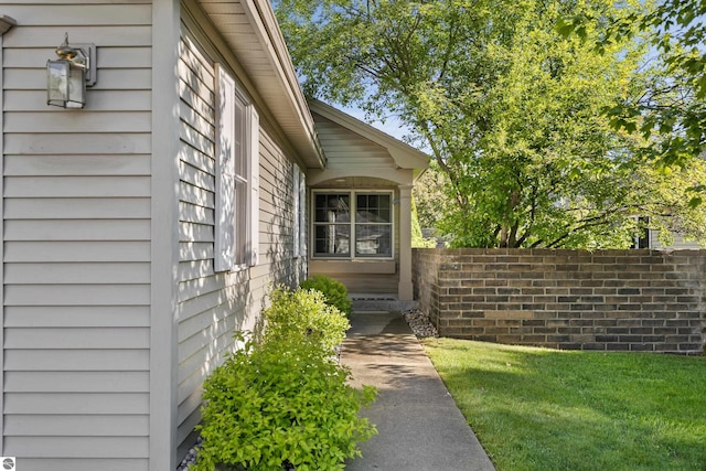 doorway to property with a yard