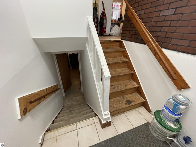 stairway with tile patterned flooring