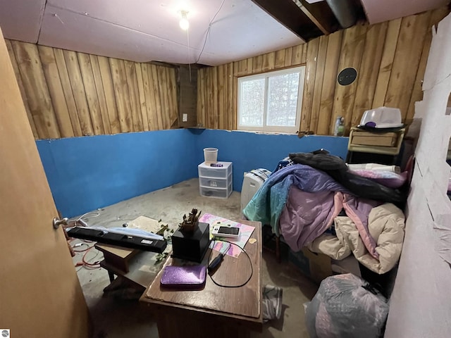 miscellaneous room featuring wooden walls