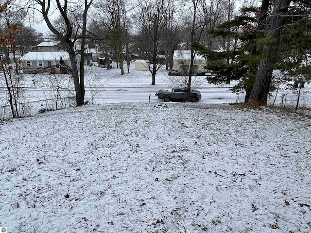 view of yard layered in snow