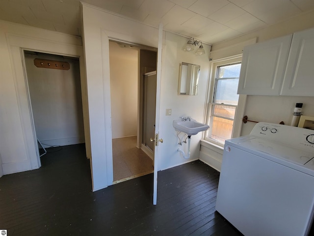 600 S Franklin St, Mount Pleasant, MI 48858 - laundry room featuring cabinets, washer / clothes dryer, a wealth of natural light, and dark wood-type flooring