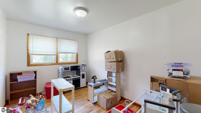 office area with light hardwood / wood-style floors