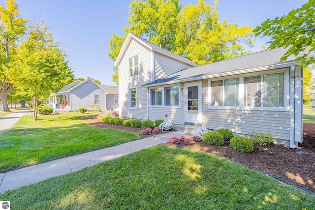 view of front of home with a front lawn