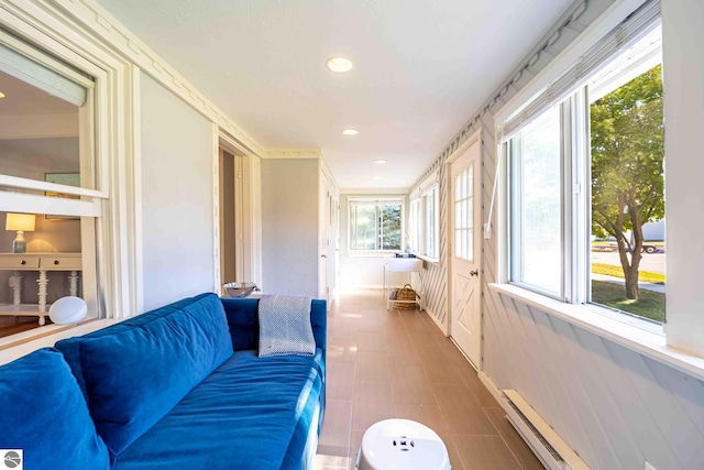 sunroom / solarium featuring a baseboard radiator