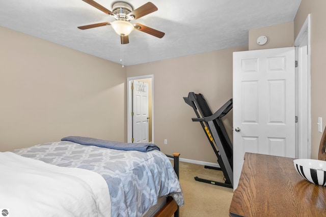 bedroom with ceiling fan and light colored carpet