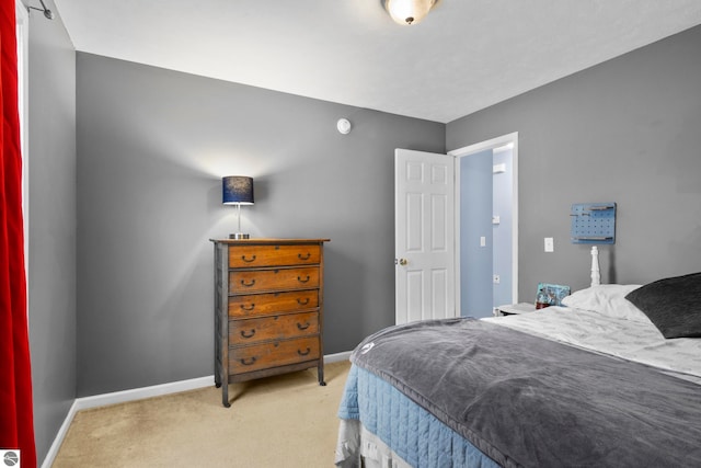 bedroom featuring light colored carpet