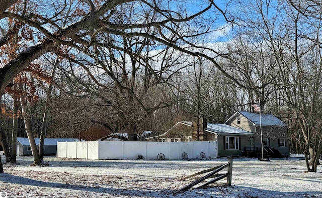 view of yard layered in snow