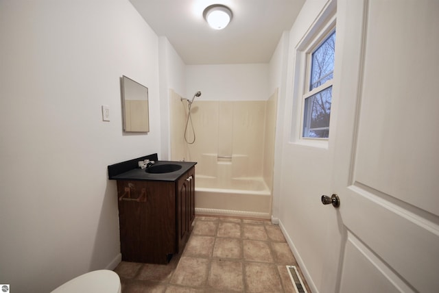 full bathroom with shower / bath combination, vanity, a healthy amount of sunlight, and toilet