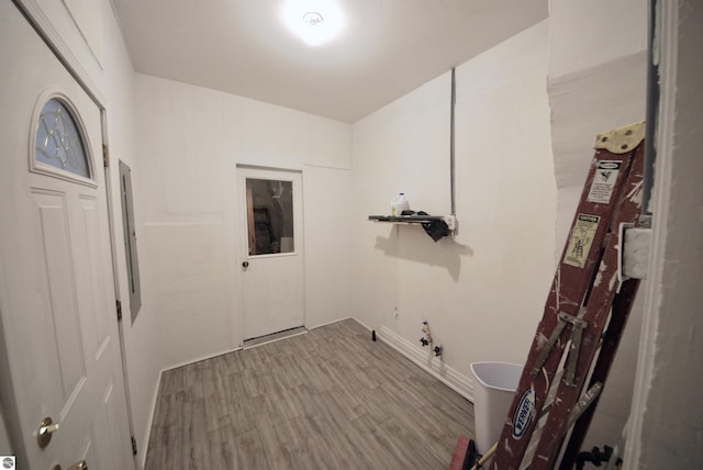 laundry area featuring hardwood / wood-style floors