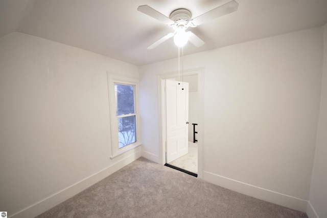 unfurnished room featuring light carpet and ceiling fan