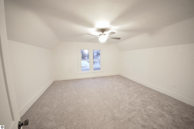 bonus room with carpet, ceiling fan, and lofted ceiling