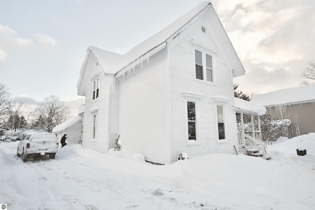 view of snow covered property