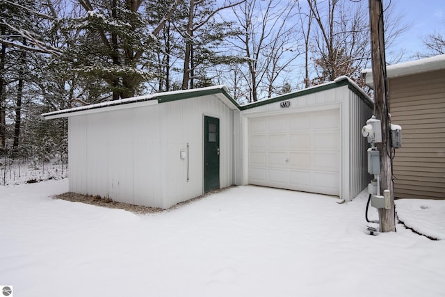 view of snow covered garage