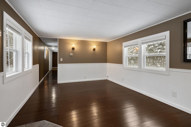 empty room featuring dark hardwood / wood-style flooring