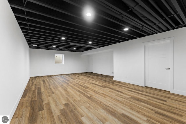 basement featuring hardwood / wood-style flooring