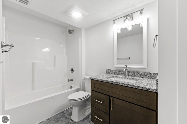 full bathroom with shower / washtub combination, vanity, a textured ceiling, and toilet