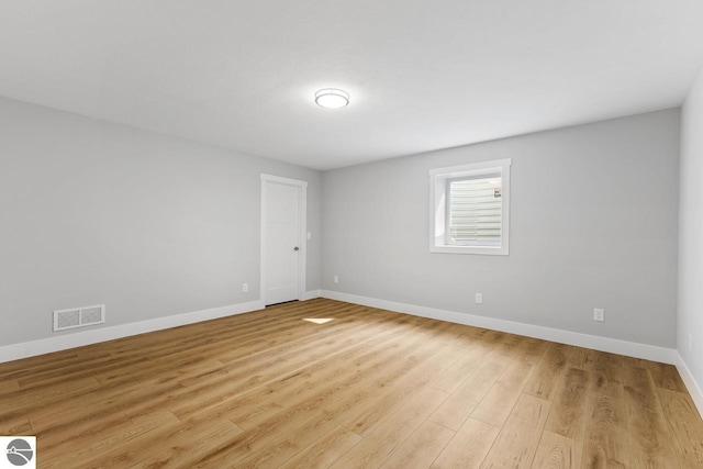 unfurnished room featuring light hardwood / wood-style floors