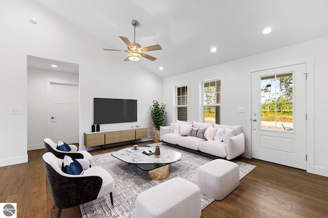 living room featuring ceiling fan, dark hardwood / wood-style flooring, and high vaulted ceiling