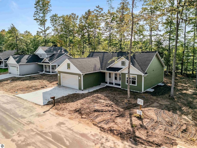 view of front of house with covered porch and a garage