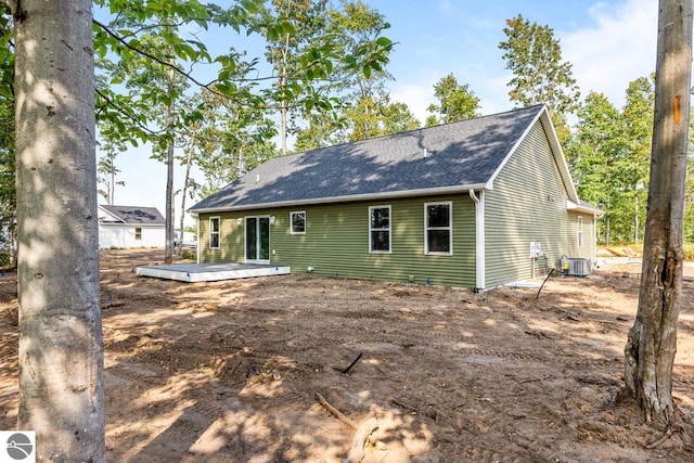 back of house featuring central AC