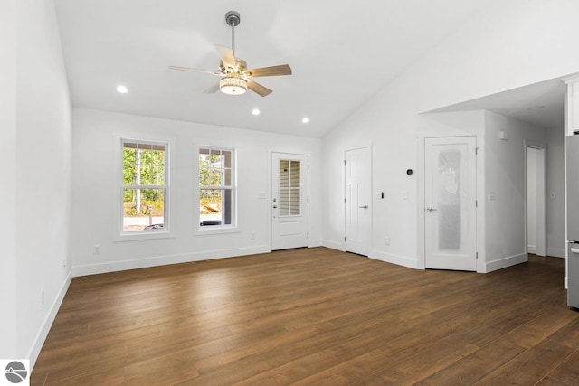 interior space featuring ceiling fan, high vaulted ceiling, and dark wood-type flooring