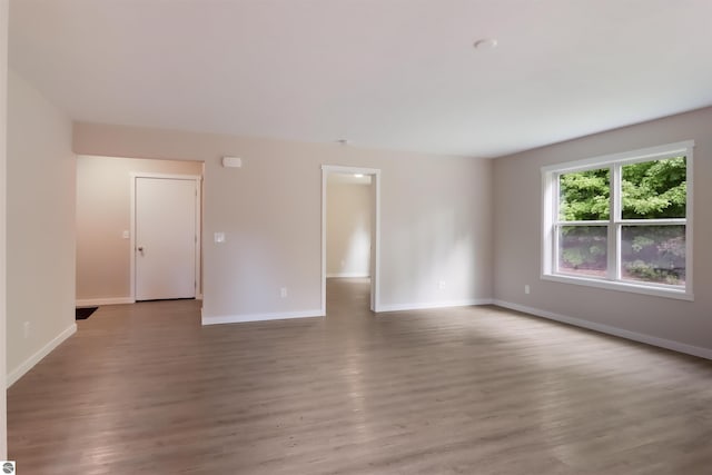 spare room with hardwood / wood-style floors