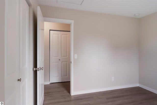 spare room with dark hardwood / wood-style flooring