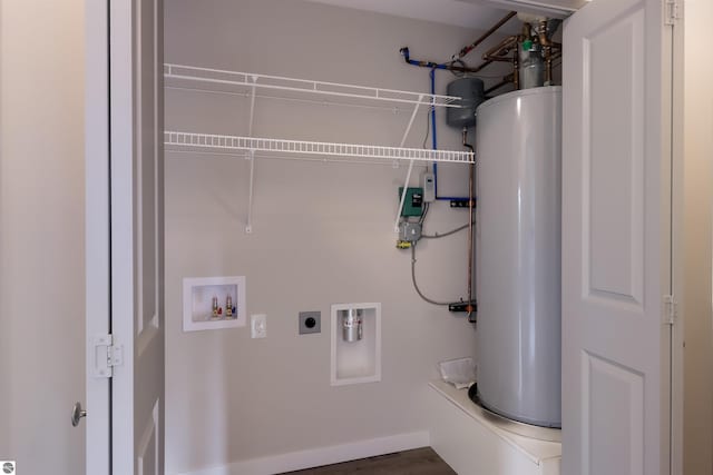 laundry room featuring electric dryer hookup, water heater, hookup for a washing machine, and dark hardwood / wood-style floors