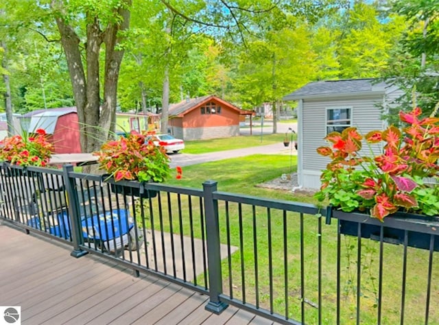 wooden deck with a yard