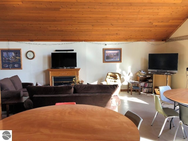 living room with concrete flooring, lofted ceiling, and wood ceiling