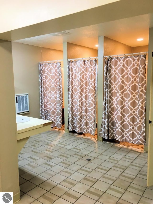 bathroom with tile patterned flooring