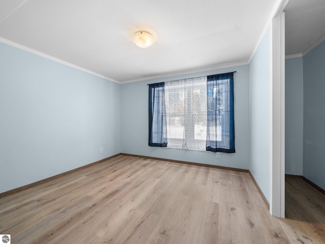 unfurnished room with light hardwood / wood-style floors and ornamental molding