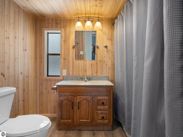 bathroom featuring hardwood / wood-style flooring, wooden walls, and wood ceiling