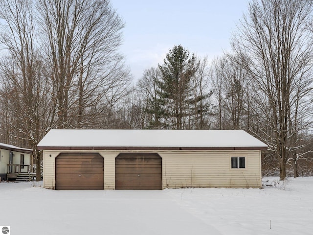 view of snow covered garage