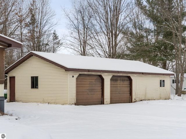 view of snow covered garage