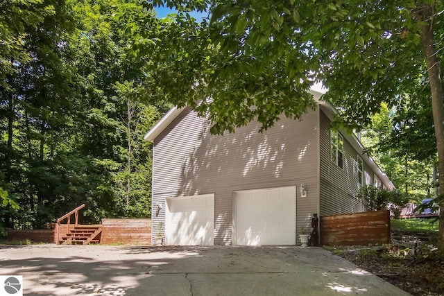 view of property exterior featuring a garage