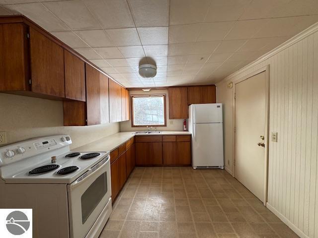 kitchen with white appliances and sink