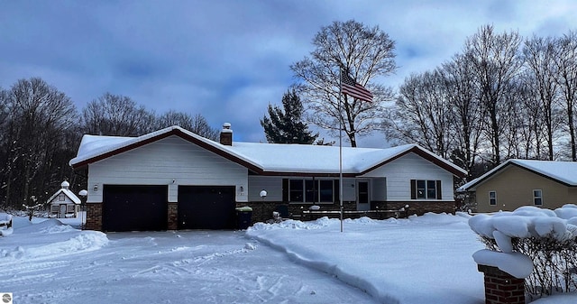 ranch-style house featuring a garage