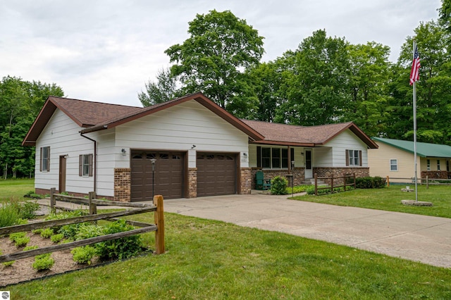 view of front of home with a garage and a front lawn