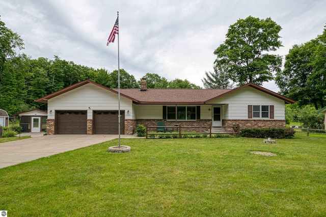 ranch-style home with a garage and a front lawn