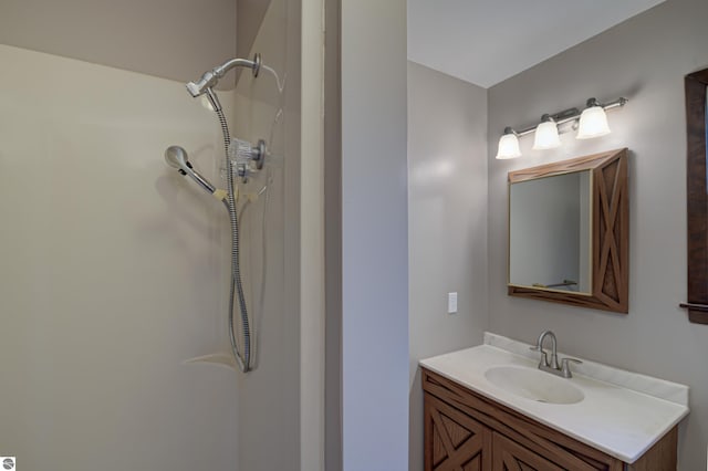 bathroom with vanity and walk in shower