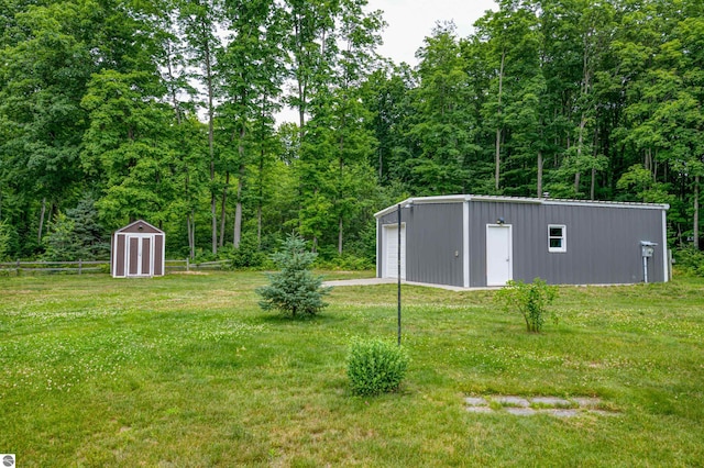 view of yard with a garage and a shed