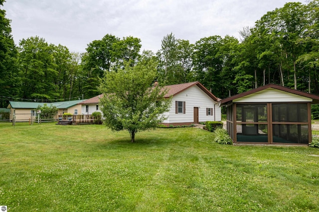 view of yard with a sunroom