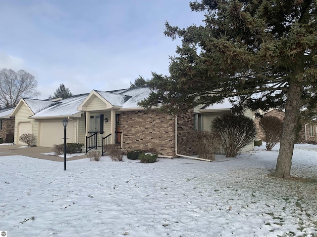 ranch-style house with brick siding and an attached garage