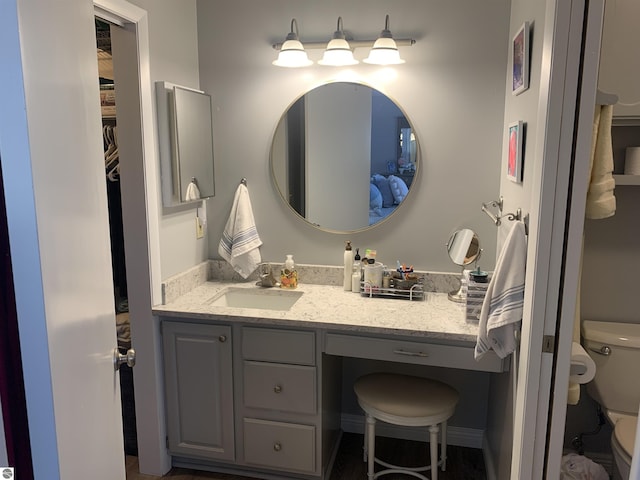 bathroom with vanity and toilet