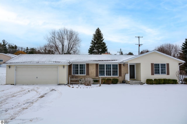 ranch-style house featuring a garage