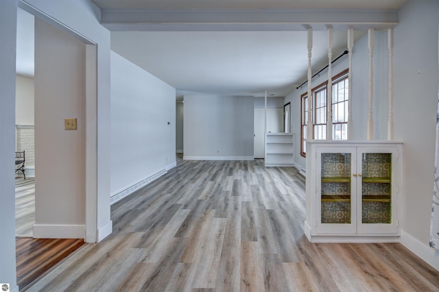 unfurnished living room with light wood-type flooring