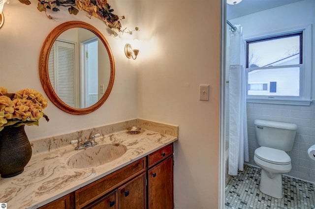 bathroom with tile patterned floors, vanity, toilet, and a shower with curtain