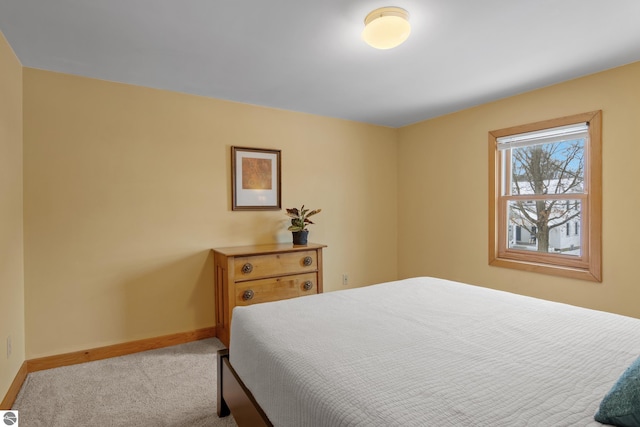 bedroom featuring light colored carpet