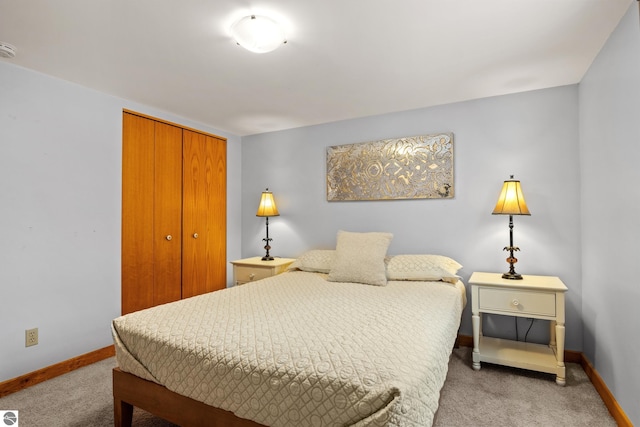 bedroom with light carpet and a closet